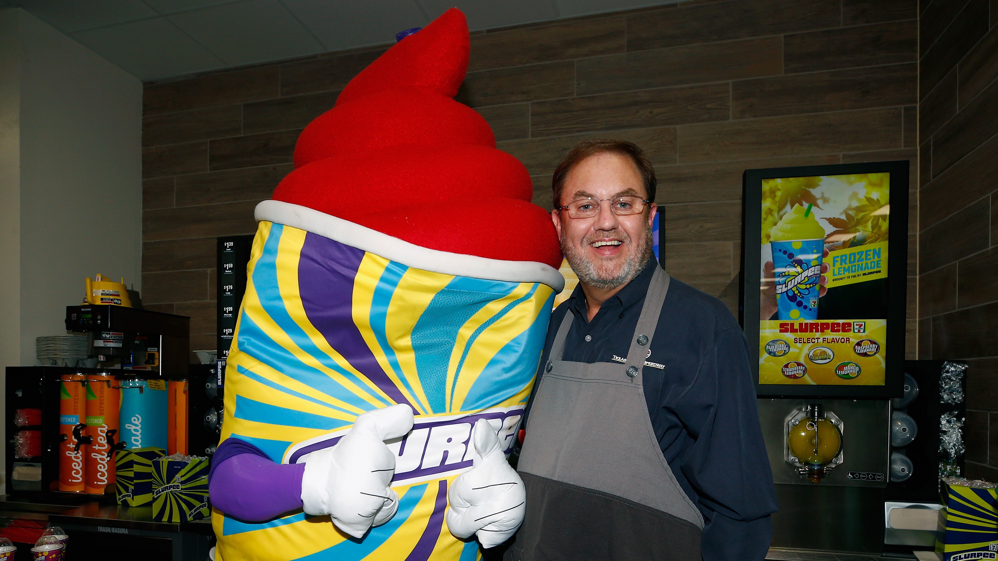 Texas Motor Speedway President Eddie Gossage serves free Slurpees to fans at Texas Motor Speedway (Photo by Matt Sullivan/Getty Images)